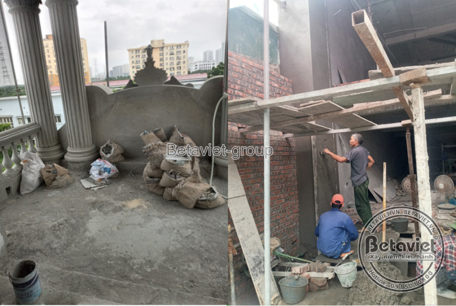 Công nhân đang trát vữa hoàn thiện bề mặt tường và cột trong không gian nội thất, chuẩn bị cho các bước hoàn thiện tiếp th…