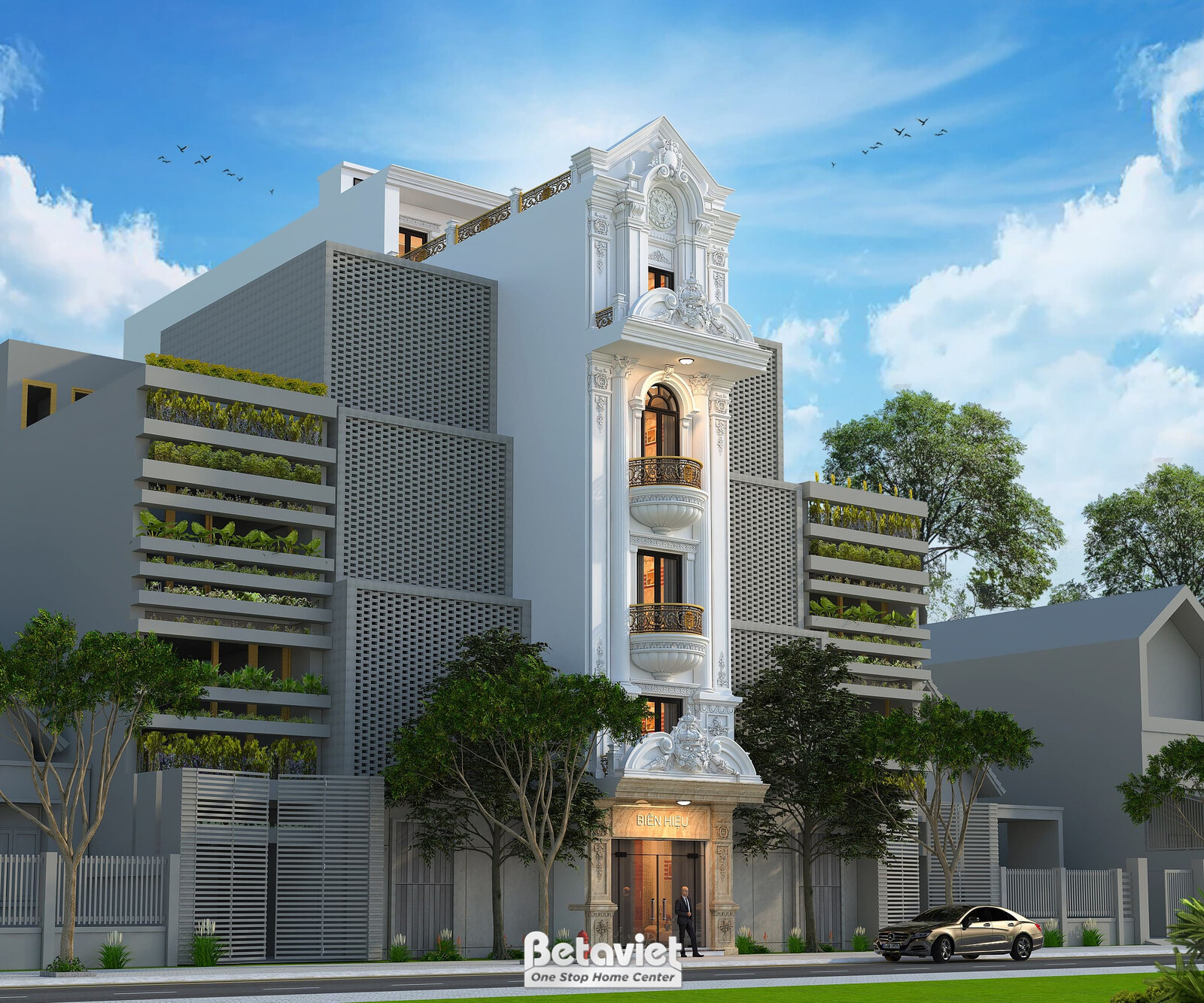 Góc chụp nghiêng lấy trọn khối nhà cùng tường rào cổng sắt hoa văn phía trước, lộ thêm mảng tường hông ốp đá trắng trơn gi…