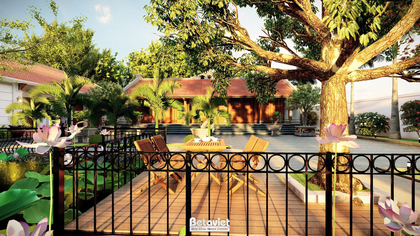 View từ sân lát gỗ nhìn ra hồ sen và dãy nhà mái ngói đỏ, ghế thư giãn đặt cạnh lan can sắt. Cây đại thụ tán rộng án ngữ g…