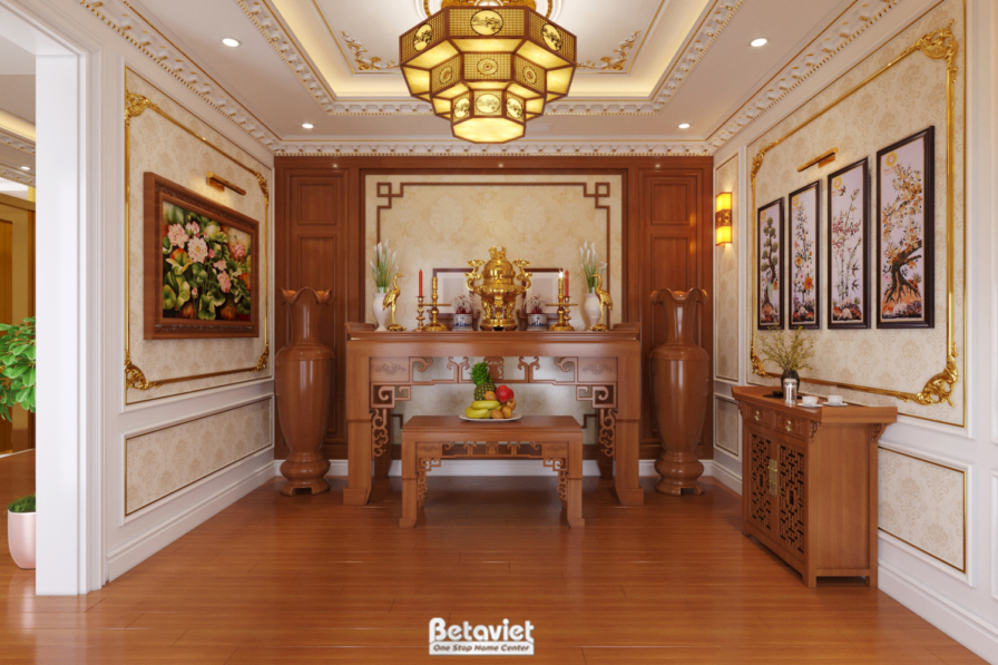 Không gian trang trọng với tủ gỗ chạm khắc tinh xảo, bàn gỗ và tranh treo tường. Trần thạch cao phào chỉ mềm mại và ánh sá…
