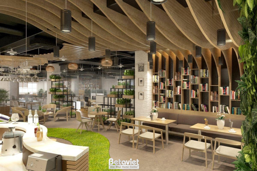 Không gian quán cafe rộng rãi nhìn từ trên cao, nổi bật với trần gỗ uốn lượn và hệ thống kệ sách âm tường cao cấp. Bố cục…