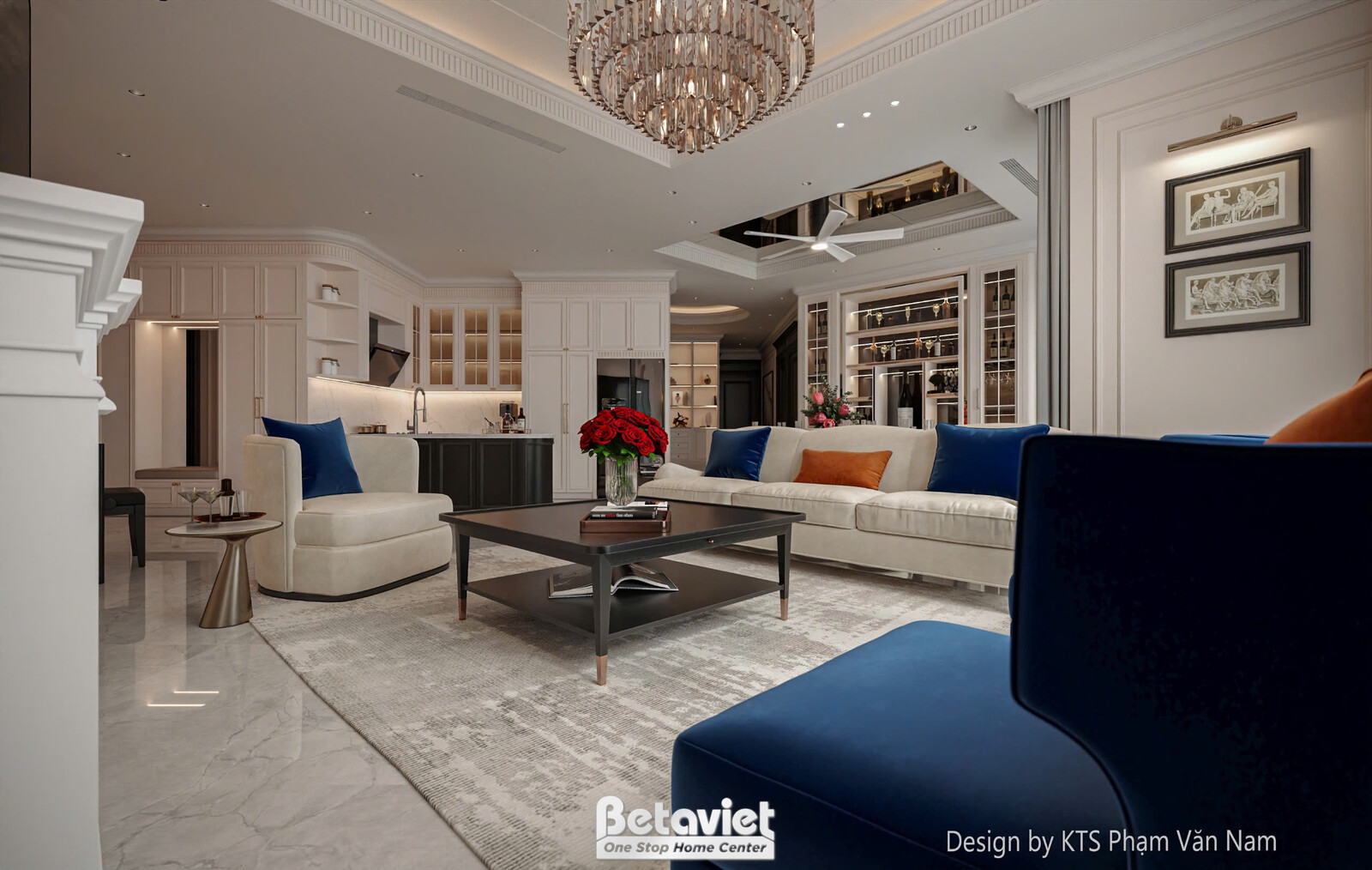 Phòng khách hiện đại nhìn từ góc rộng, với sofa chữ L màu be và gối xanh cobalt, bàn trà tối giản màu đen. Đèn chùm pha lê…