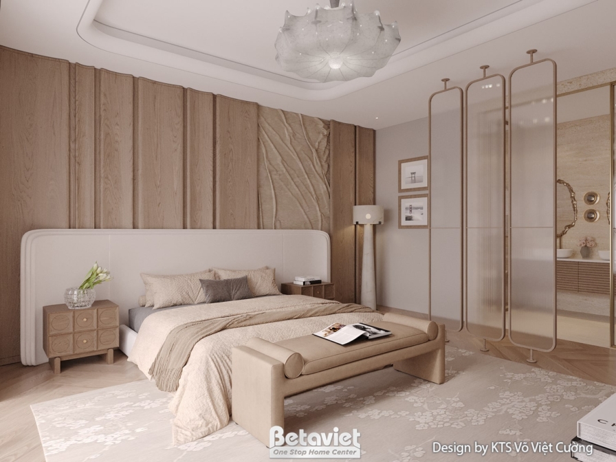 Phòng ngủ với giường đôi, đầu giường ốp gỗ và đá vân. Bàn trang điểm nhỏ gọn. Vách ngăn kính với khu vực vệ sinh tạo sự li…