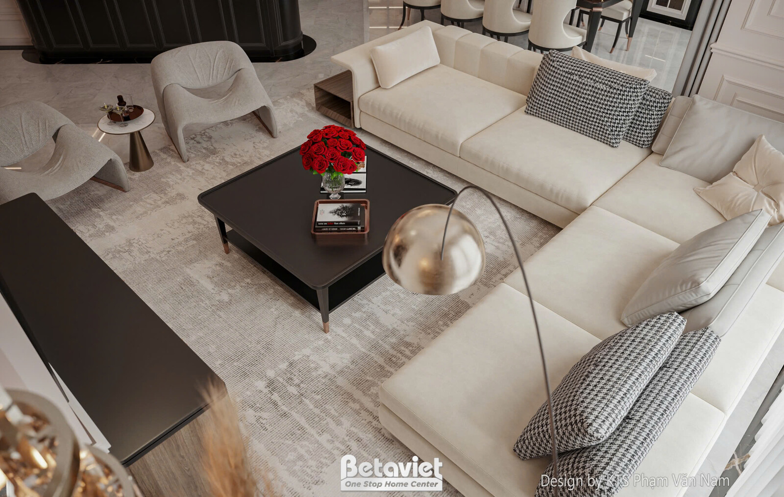 Góc nhìn tổng thể phòng khách từ trên cao, với sofa chữ L màu kem và bàn trà trung tâm. Thảm trải sàn tối giản và gối tựa…