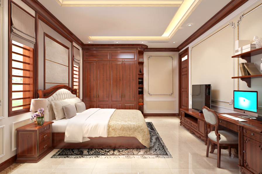 Phòng ngủ bố cục gương với góc bàn làm việc, màn hình máy tính, tủ áo gỗ. Giường bọc nệm kem, sàn đá sáng màu, đèn trần âm…