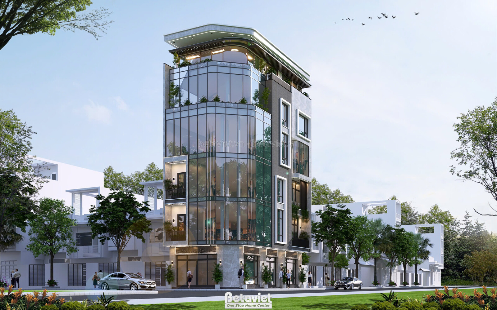 Ngoại thất tòa nhà mặt phố hiện đại luxury nhìn từ góc thấp, tập trung vào mặt tiền với khối kính uốn cong và các cửa hàng…