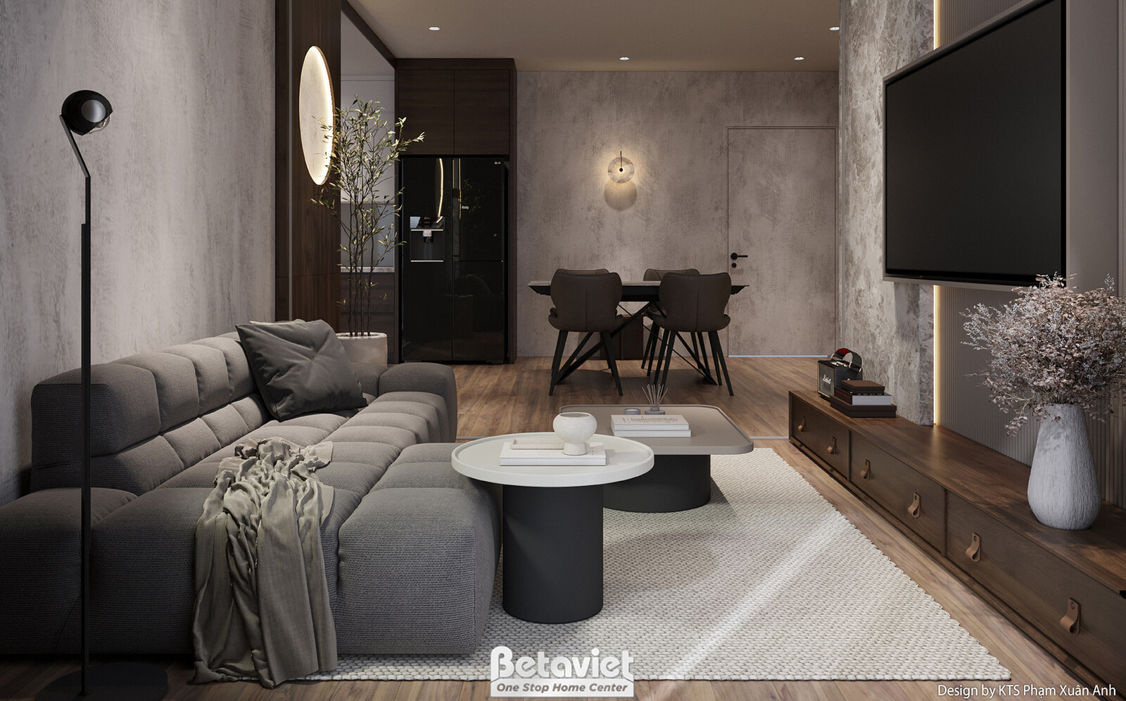 Góc nhìn tổng thể phòng khách với kệ tivi gỗ dài, tivi treo tường. Sofa chữ L màu xám, bàn trà đôi. Tường ốp bê tông giả t…