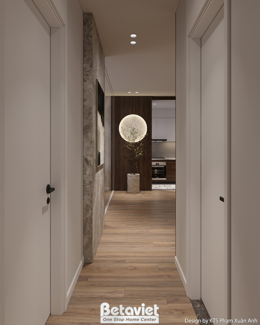 Góc nhìn dọc hành lang dẫn vào các phòng, với cửa gỗ tối màu và tường ốp bê tông giả thô. Ánh sáng từ đèn trần và đèn tườn…
