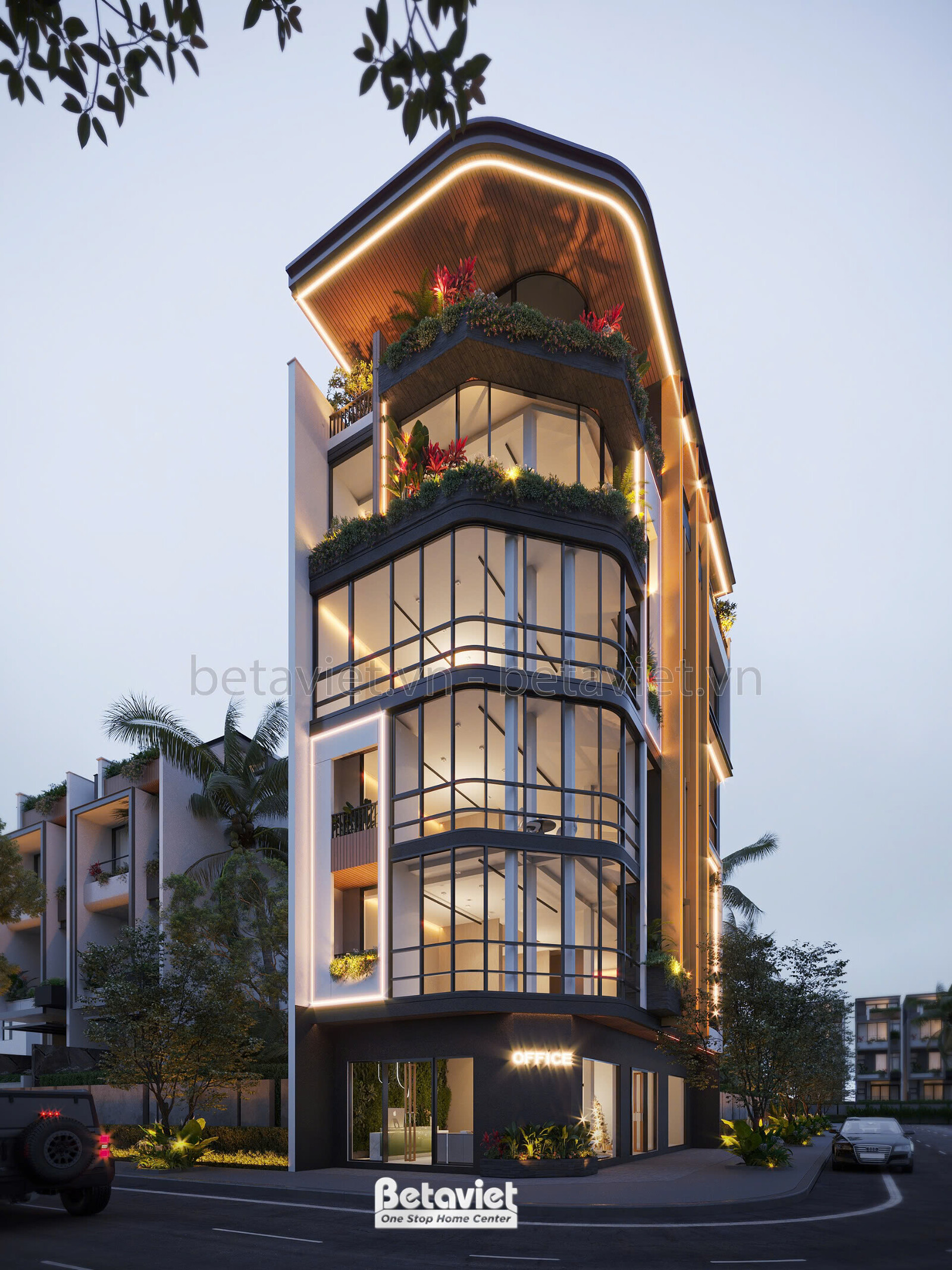 Góc nhìn chếch từ dưới lên của tòa nhà vào buổi tối, làm nổi bật hình khối cong mềm mại và hệ thống chiếu sáng tinh tế. Cá…
