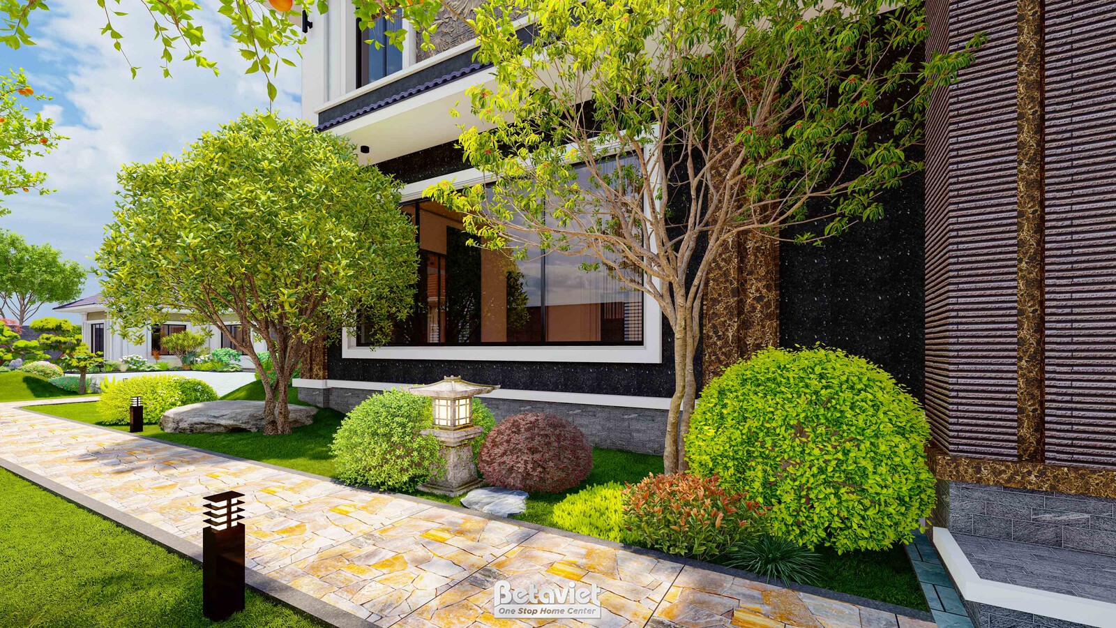 Lối vào chính hông nhà với đèn sân vườn dạng cột đá, chậu đá tròn nhỏ trang trí, bụi cây tròn cắt tỉa gọn gàng, mặt tiền ố…