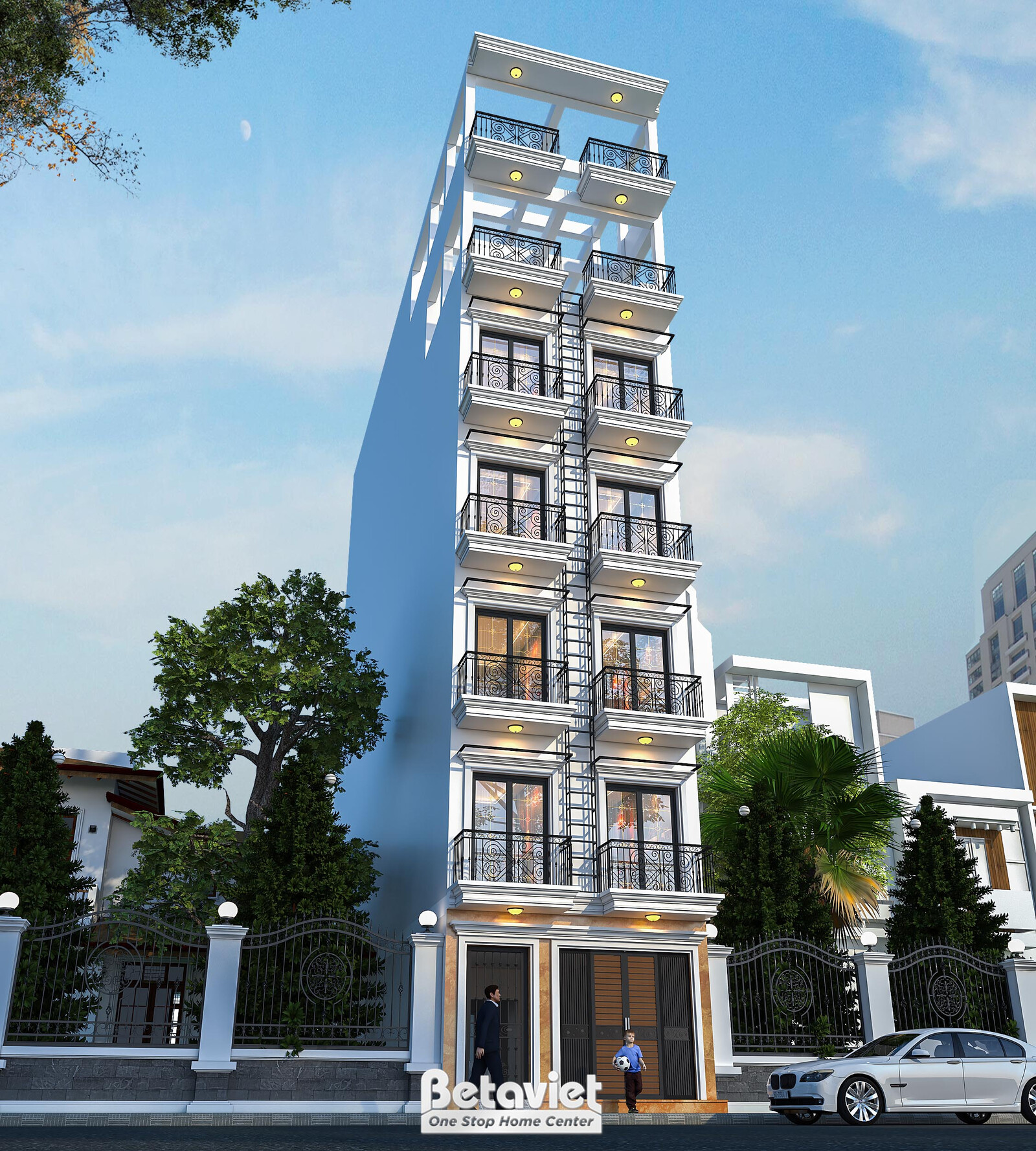 Góc nhìn cận cảnh hơn với hàng cây xanh rậm rạp che một phần tầng trệt, nổi bật hệ cửa kính lớn khung nhôm sơn giả cổ nâu…