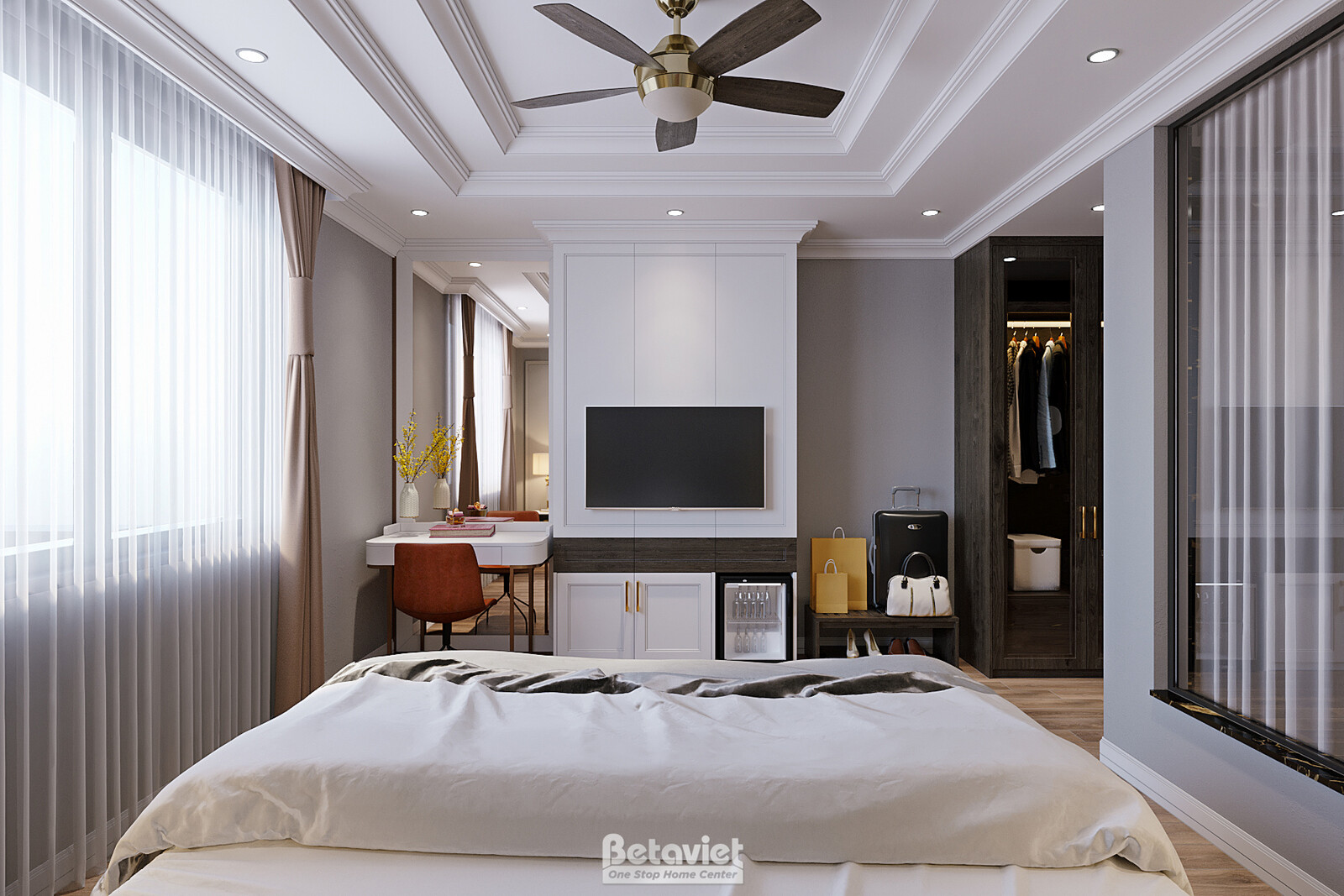 Phòng ngủ khách sạn với bàn làm việc, tủ minibar, quạt trần, tủ quần áo mở cạnh giường ga trắng. Không gian gọn gàng tiện…