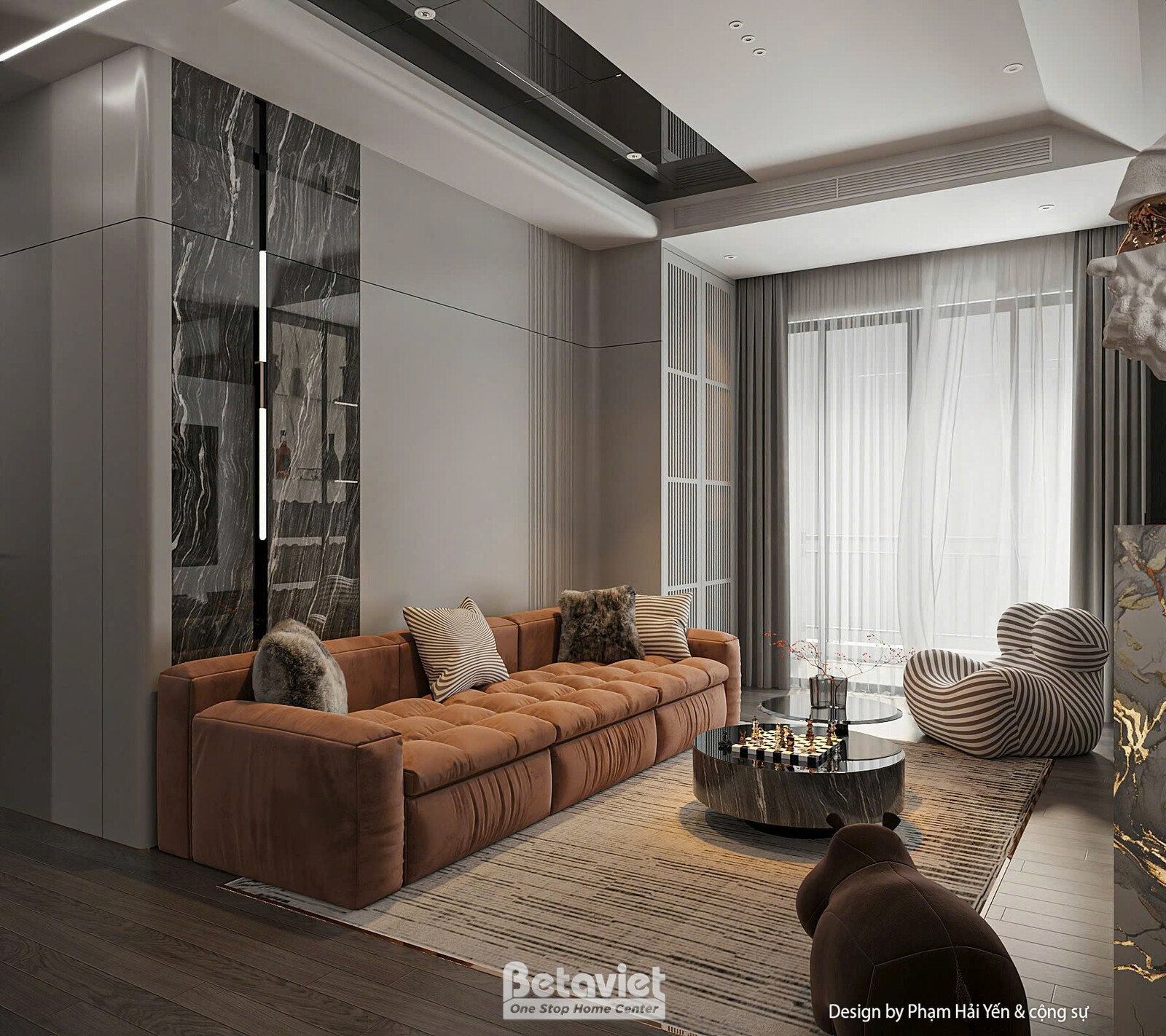 Cận cảnh sofa nhung nâu cam nhiều gối tựa, phía sau là vách đá marble đen vân trắng ốp cột nhà. Rèm voan trắng mềm mại, sà…