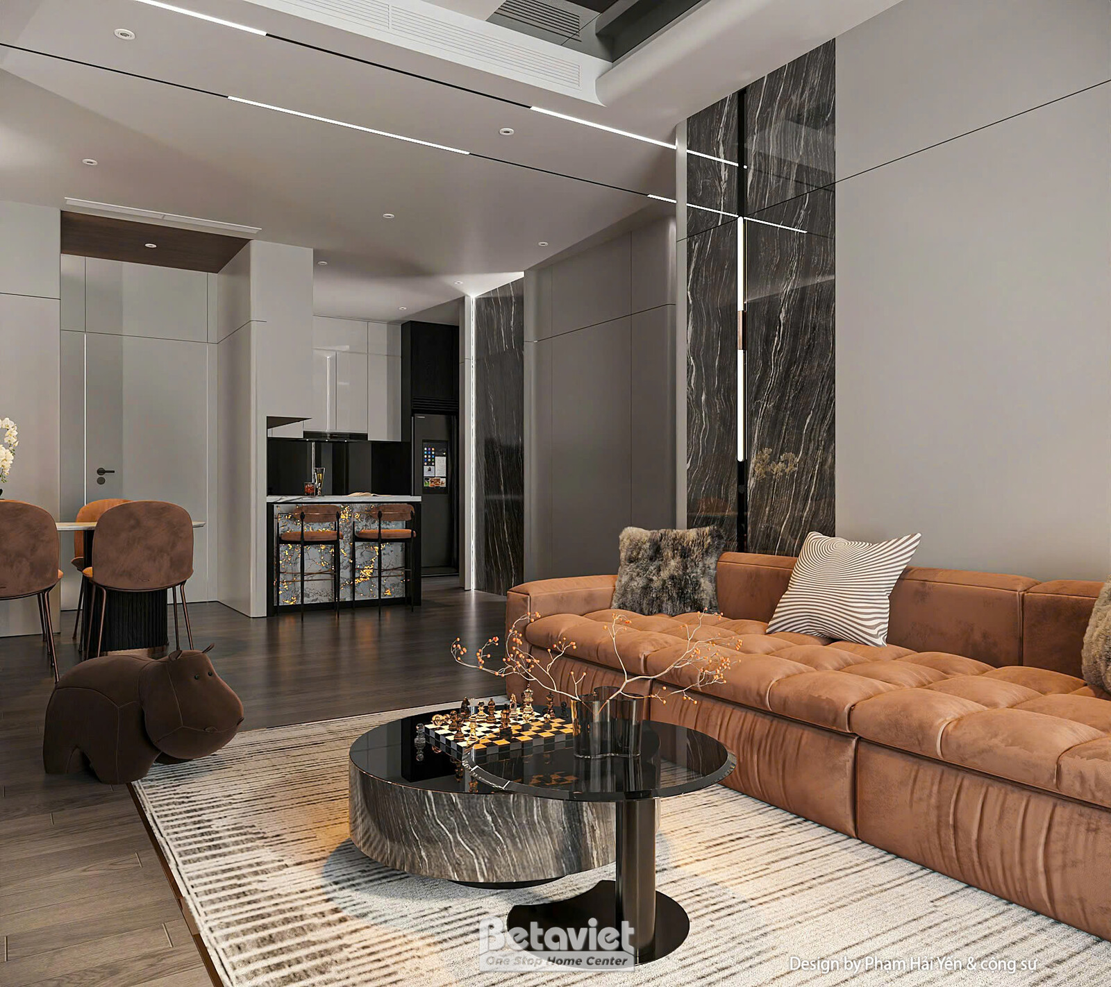 Góc nhìn xuyên phòng khách sang khu bếp phía sau, sofa nhung nâu cam nổi bật cạnh bàn trà đá đen, vách đá marble đen ốp cộ…