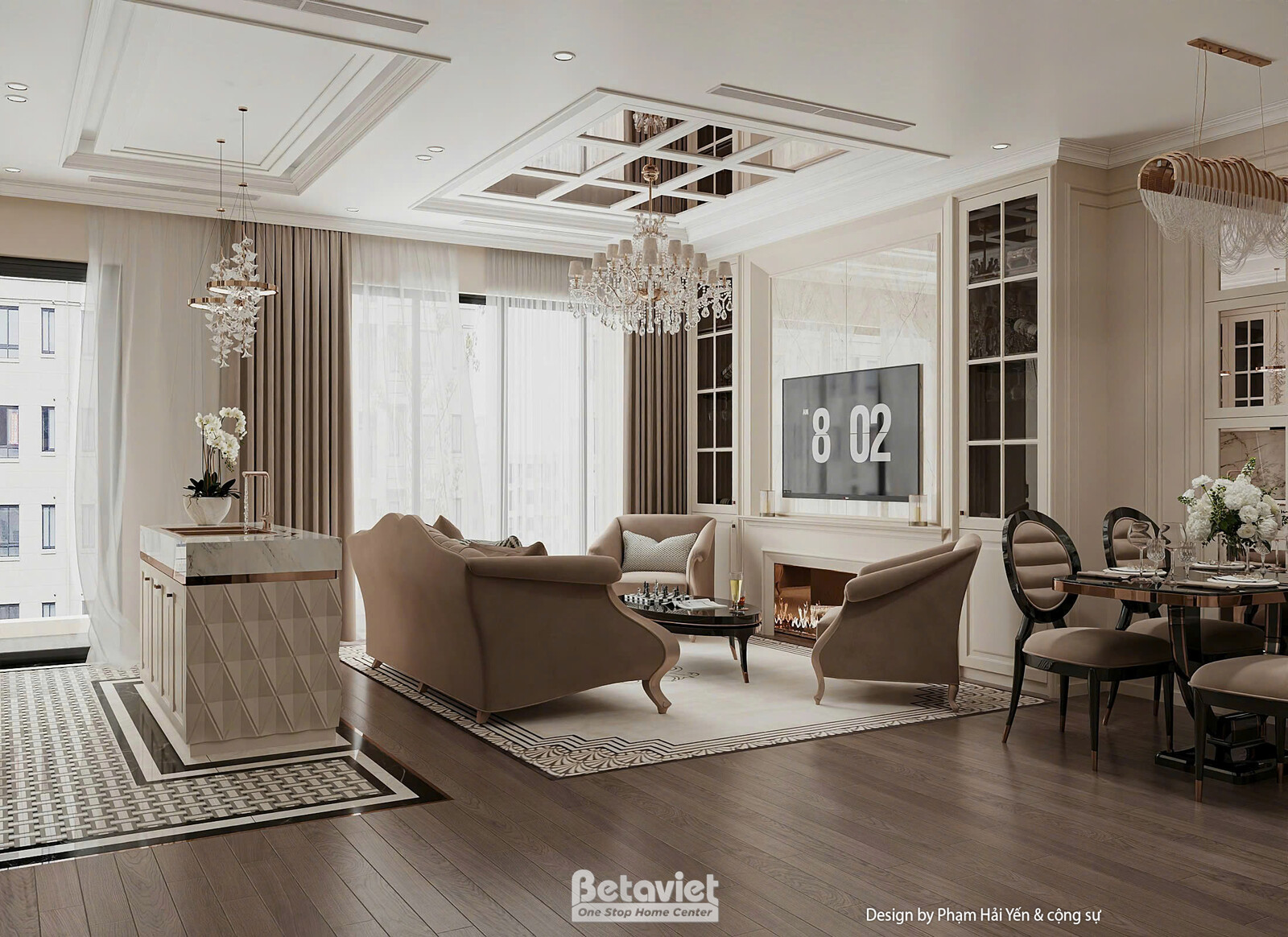 Toàn cảnh phòng khách liên thông phòng ăn, sofa cong bọc nỉ be, phía sau là bàn ăn tròn ghế bọc nỉ tối màu, tủ kệ trắng ch…