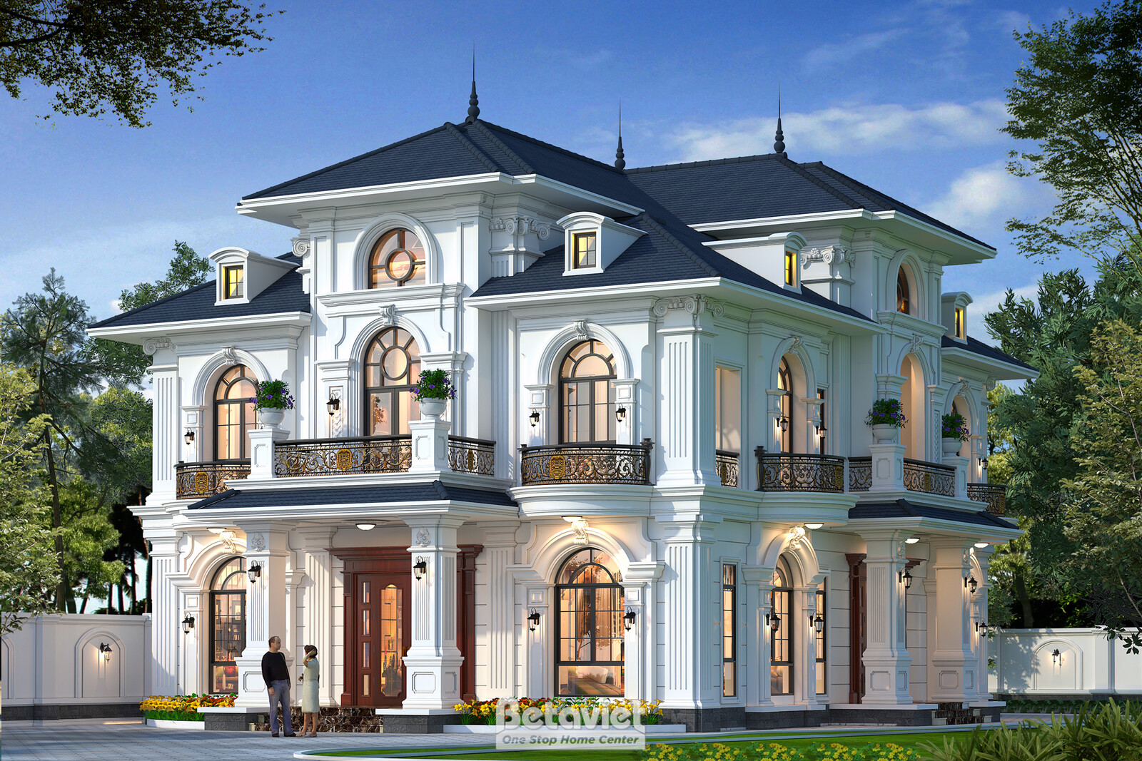 Góc chính diện đối xứng lúc hoàng hôn, cửa chính gỗ hai cánh vòm cung, ban công sắt nghệ thuật ngay phía trên, sân lát đá…