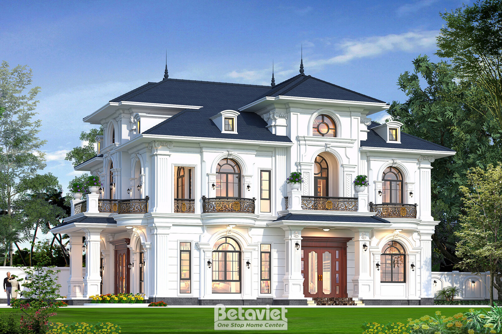 Góc sân bên phải ban ngày, gazebo mái chóp nhỏ ở tiền cảnh, mái nhà nhiều lớp lô nhô với các cửa sổ áp mái, hệ cửa sổ vòm…